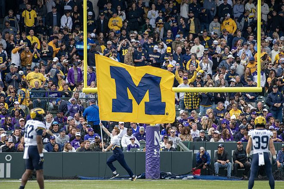 Jalen Hoffman (42), Joe Taylor (39), and Michigan Cheerleaders