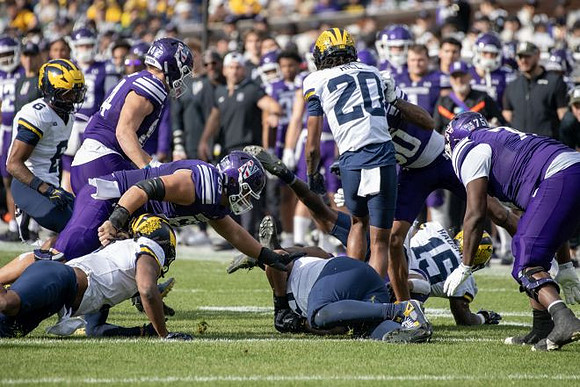 Brandyn Hillman (6), Ernest Hausmann (15), and Jyaire Hill (20)