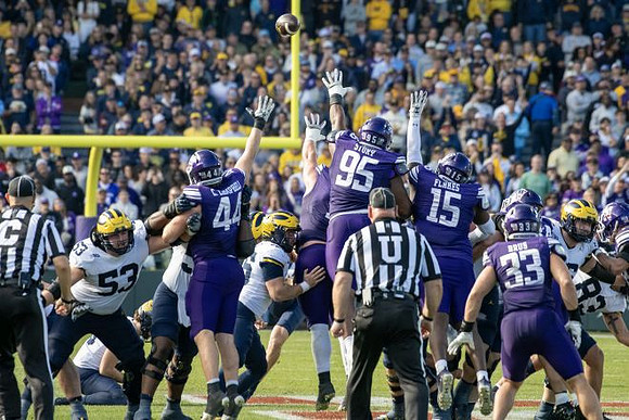 Jake Guarnera (53) and Zack Marshall (83)