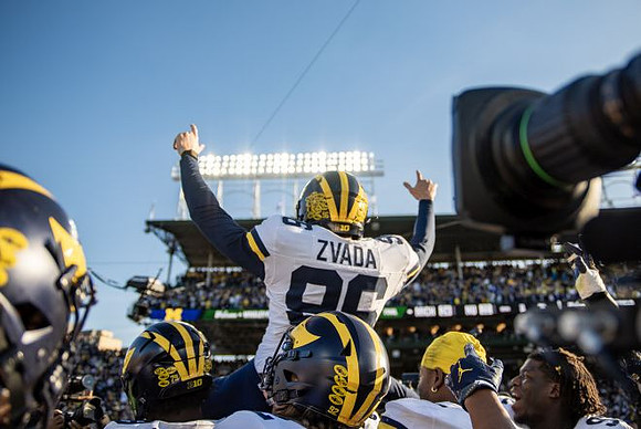Dominic Zvada (96) and Michigan Team