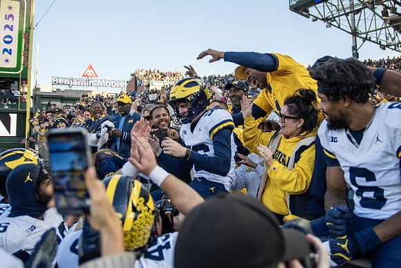 Dominic Zvada (96) and Michigan Team