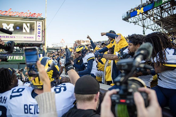 Dominic Zvada (96) and Michigan Team