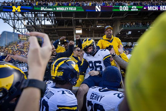 Dominic Zvada (96) and Michigan Team