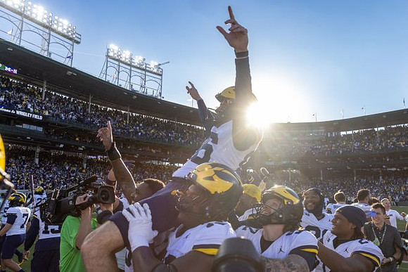 Dominic Zvada (96) and Michigan Team