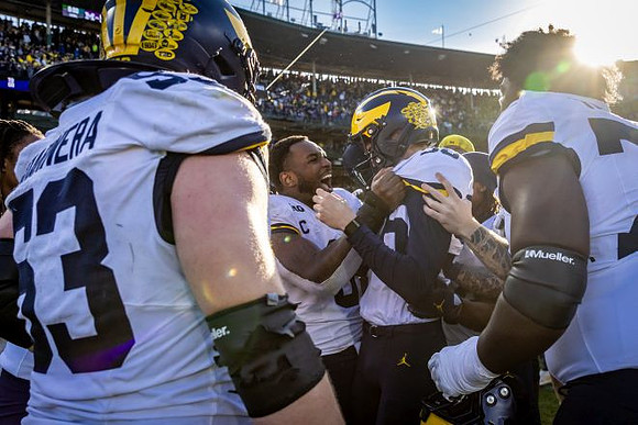 Dominic Zvada (96) and Michigan Team