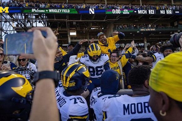 Dominic Zvada (96) and Michigan Team