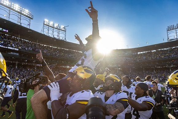 Dominic Zvada (96) and Michigan Team