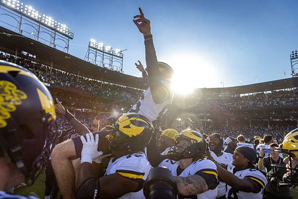 Dominic Zvada (96) and Michigan Team