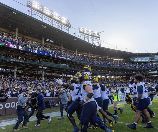 Dominic Zvada (96) and Michigan Team