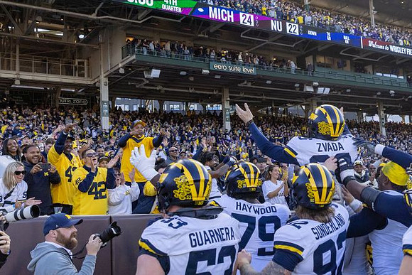 Dominic Zvada (96) and Michigan Team