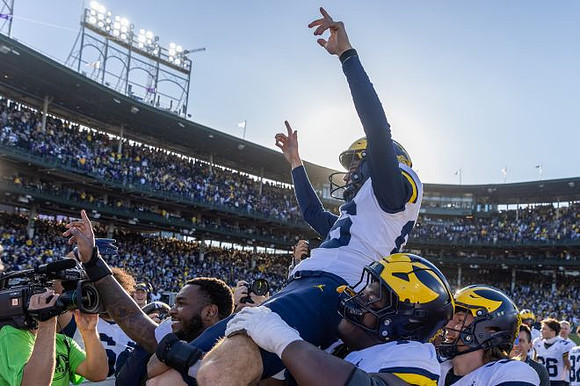 Dominic Zvada (96) and Michigan Team