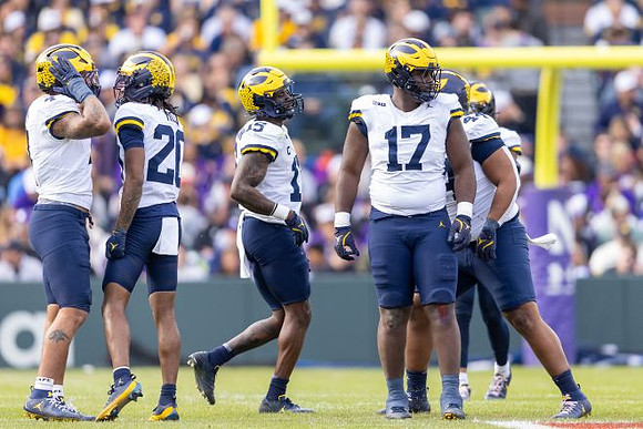 TJ Guy (4), Jyaire Hill (20), Ernest Hausmann (15), Enow Etta (17), and Damon Payne (44)