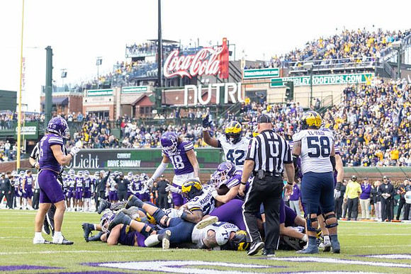 Blake Frazier (77), Jalen Hoffman (42), Giovanni El-Hadi (58), and Jordan Marshall (23)