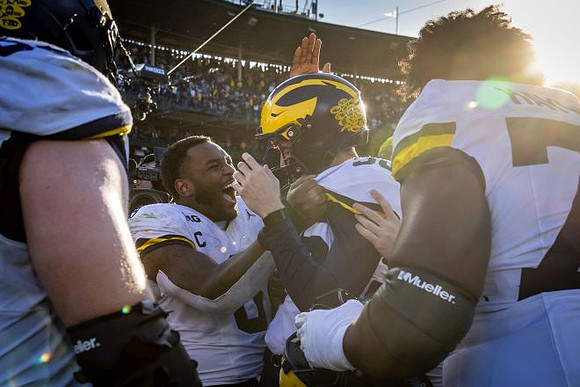 Dominic Zvada (96) and Michigan Team