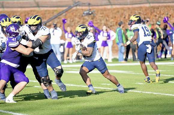 Blake Frazier (77), Jordan Marshall (23), and Bryce Underwood (19)
