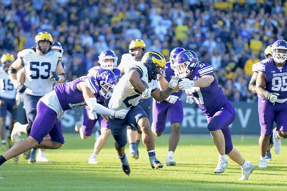 Bryce Underwood (19), Jake Guarnera (53), and Jordan Marshall (23)