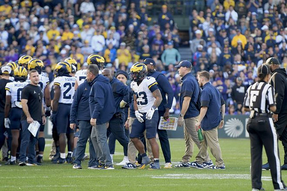 Jordan Marshall (23) and Michigan Team