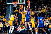 Morez Johnson Jr. (21), Yaxel Lendeborg (23), and Nimari Burnett (4)