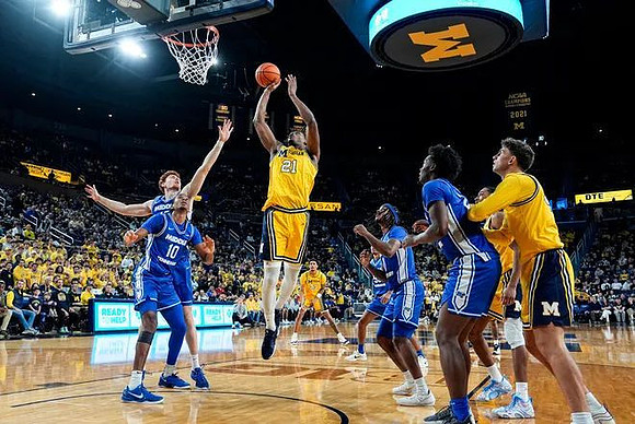 Morez Johnson Jr. (21), Will Tschetter (42), Nimari Burnett (4), and Yaxel Lendeborg (23)
