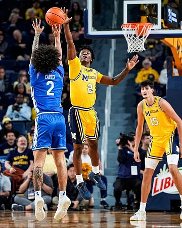 L.J. Cason (2) and Aday Mara (15)