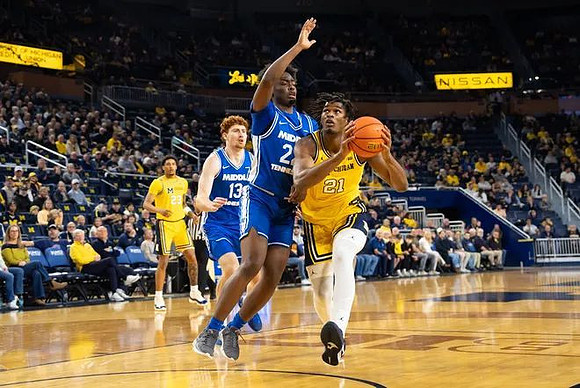 Yaxel Lendeborg (23) and Morez Johnson Jr. (21)