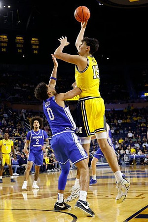 L.J. Cason (2) and Aday Mara (15)
