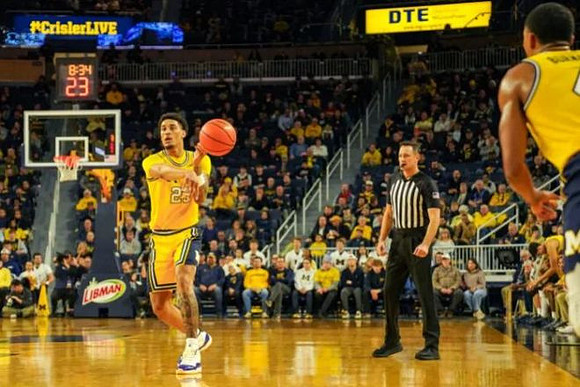 Yaxel Lendeborg (23) and Nimari Burnett (4)