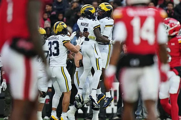Blake Frazier (77), Jordan Marshall (23), Andrew Marsh (4), and Bryce Underwood (19)