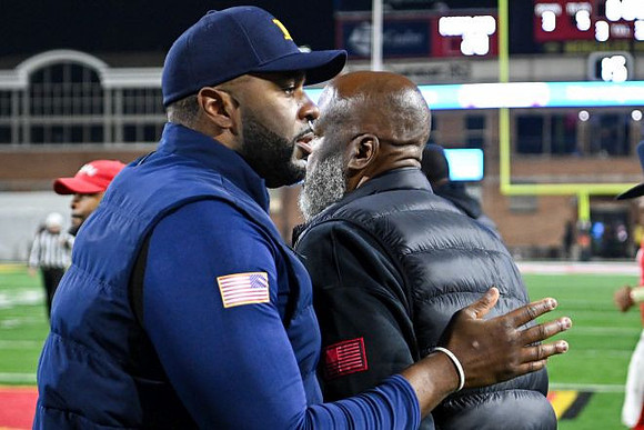 Sherrone Moore and Maryland Head Coach Mike Locksley