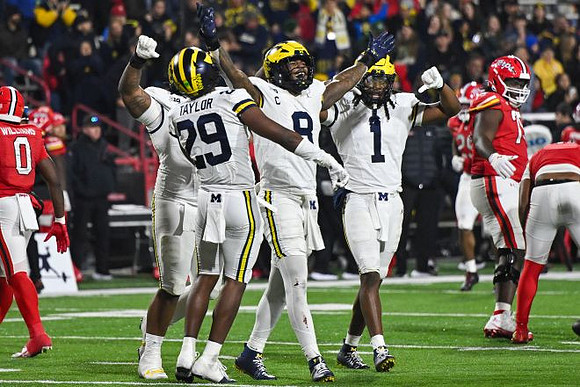 Chase Taylor (29), Derrick Moore (8), and Jaishawn Barham (1)
