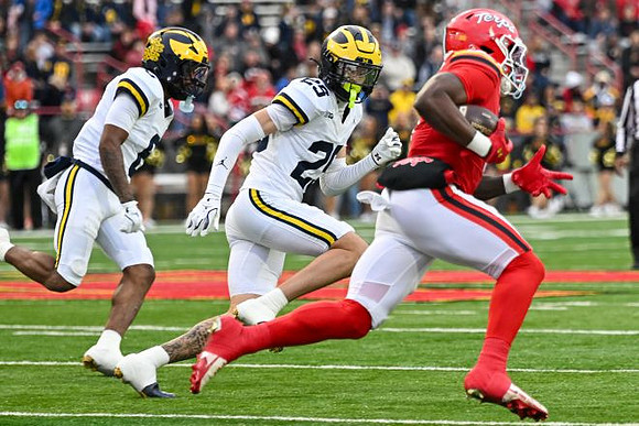Derrick Moore (8) and Mason Curtis (25)