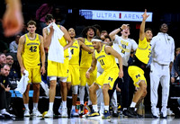 Roddy Gayle Jr. (11) and Michigan Team
