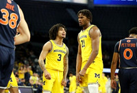 Elliot Cadeau (3) and Morez Johnson Jr. (21)