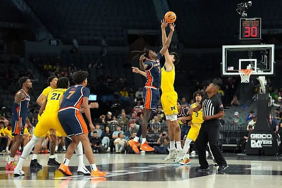 Yaxel Lendeborg (23), Morez Johnson Jr. (21), Aday Mara (15), and Elliot Cadeau (3)