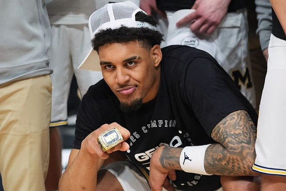 Yaxel Lendeborg (23) and Players Era Tournament Championship MVP Ring