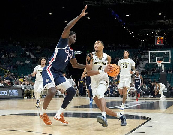 Elliot Cadeau (3), Nimari Burnett (4), and Yaxel Lendeborg (23)