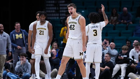 Yaxel Lendeborg (23), Morez Johnson Jr. (21), Will Tschetter (42), and Elliot Cadeau (3)