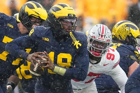 Blake Frazier (77), Bryce Underwood (19), and Greg Crippen (51)