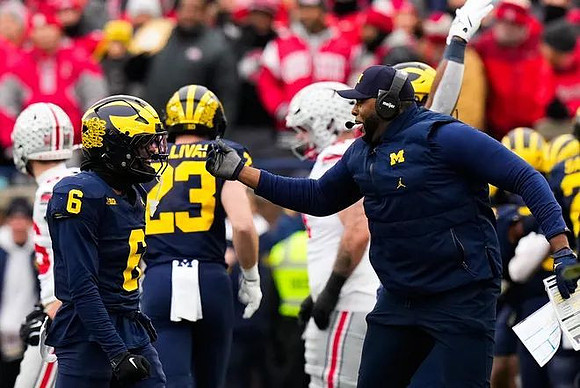 Brandyn Hillman (6), Cole Sullivan (23), and Ohio State Head Coach Ryan Day