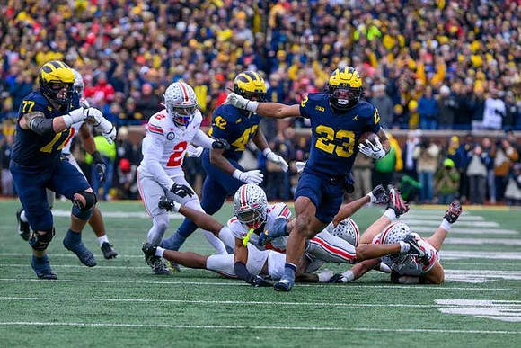 Blake Frazier (77), Jalen Hoffman (42), and Jordan Marshall (23)