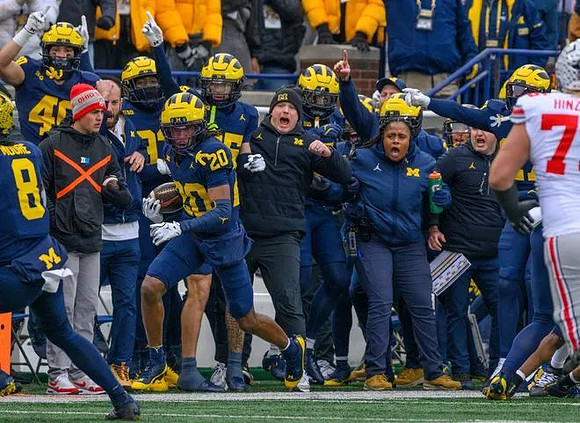 Derrick Moore (8) and Jyaire Hill (20)