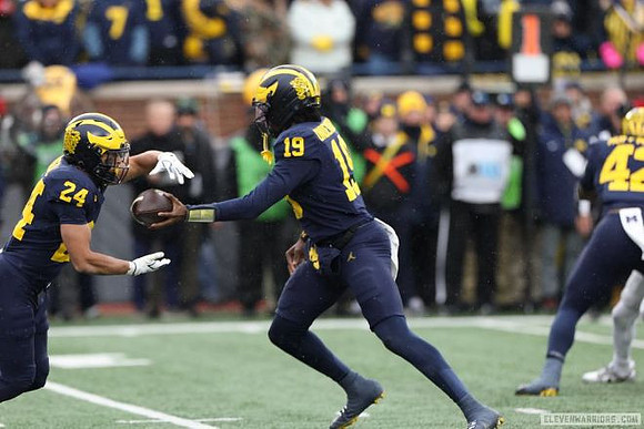 Bryson Kuzdzal (24), Bryce Underwood (19), and Jalen Hoffman (42)