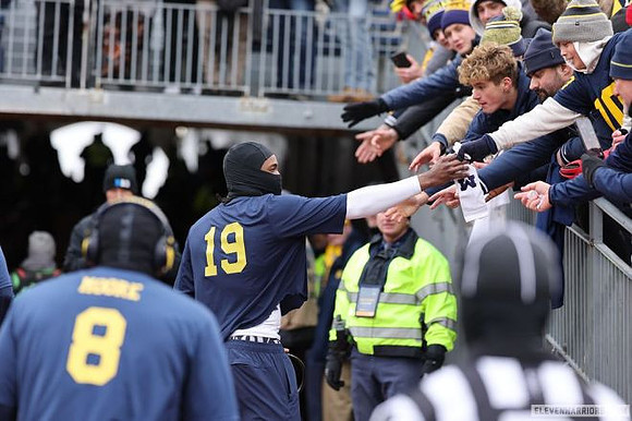 Derrick Moore (8) and Bryce Underwood (19)