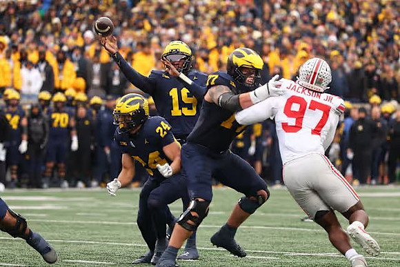 Bryson Kuzdzal (24), Bryce Underwood (19), and Blake Frazier (77)