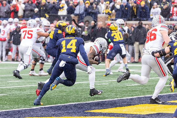 Jordan Young (14), Trey Pierce (95), and Jimmy Rolder (30)