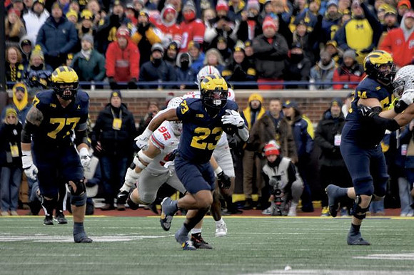 Blake Frazier (77), Jordan Marshall (23), and Andrew Sprague (54)