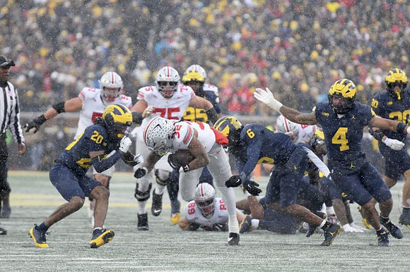 Jyaire Hill (20), Trey Pierce (95), Brandyn Hillman (6), TJ Guy (4), and Jimmy Rolder (30)