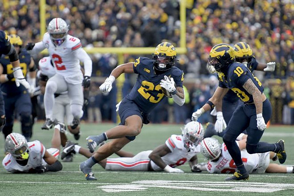 Jake Guarnera (53), Jordan Marshall (23), and Kendrick Bell (10)