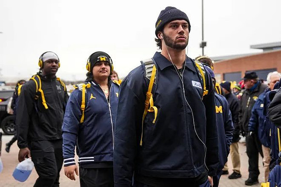Marlin Klein (17) and Michigan Team