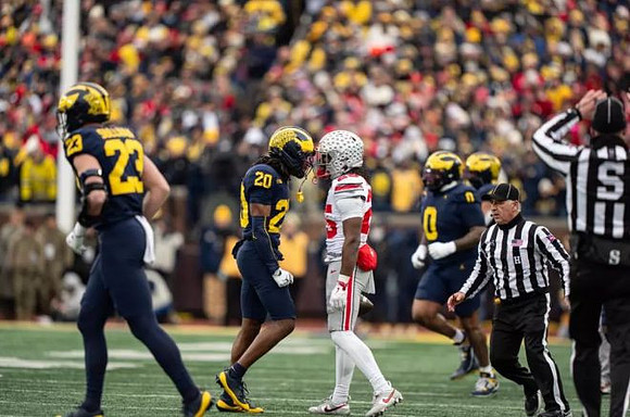 Cole Sullivan (23), Jyaire Hill (20), and Tré Williams (0)